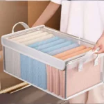 ⁦منظم ملابس ووتربروف شفاف بقوائم معدنية – مقاس 47×30×19 سم⁩ - الصورة ⁦2⁩